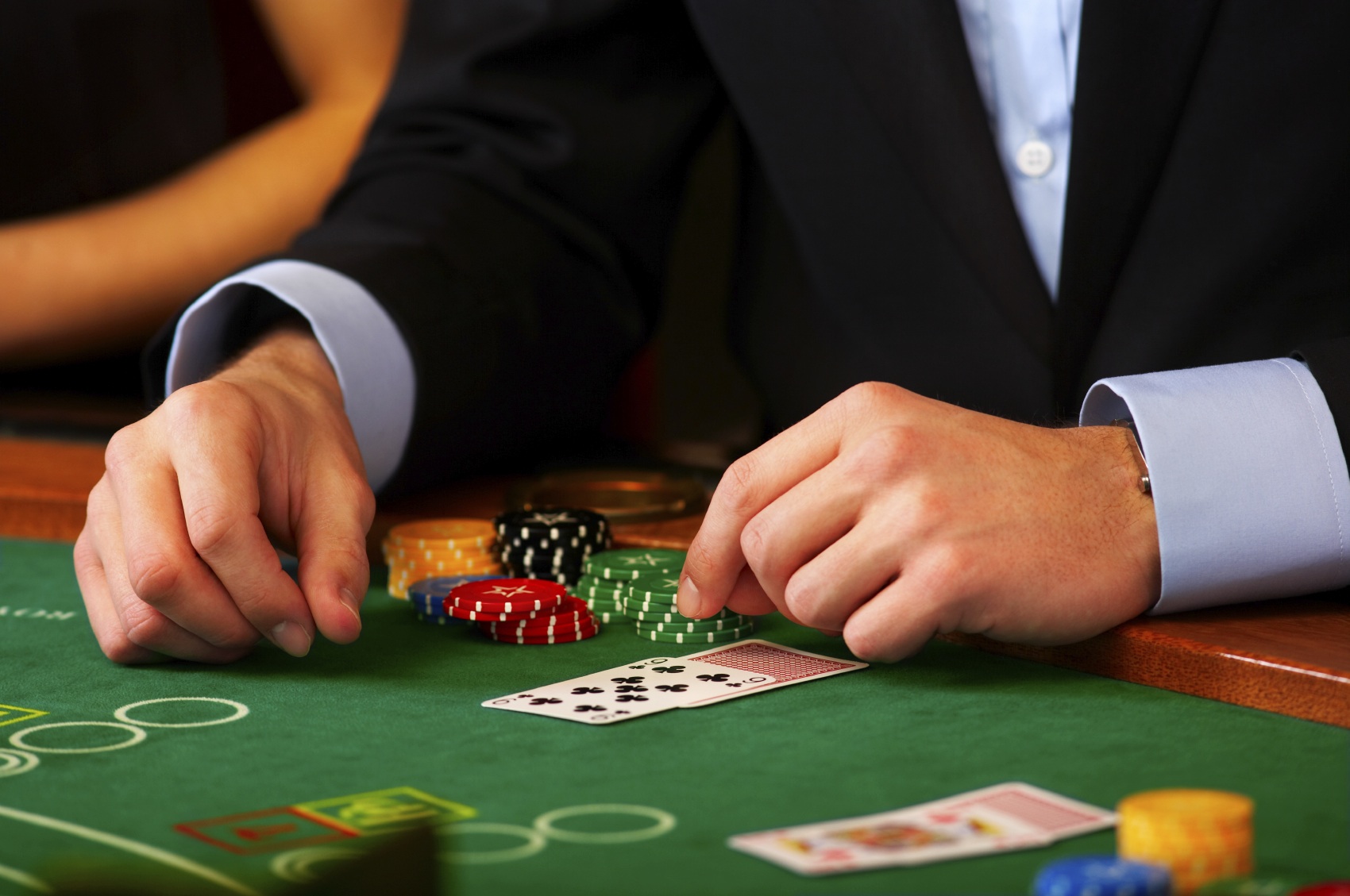 Dealer handling cards at a casino